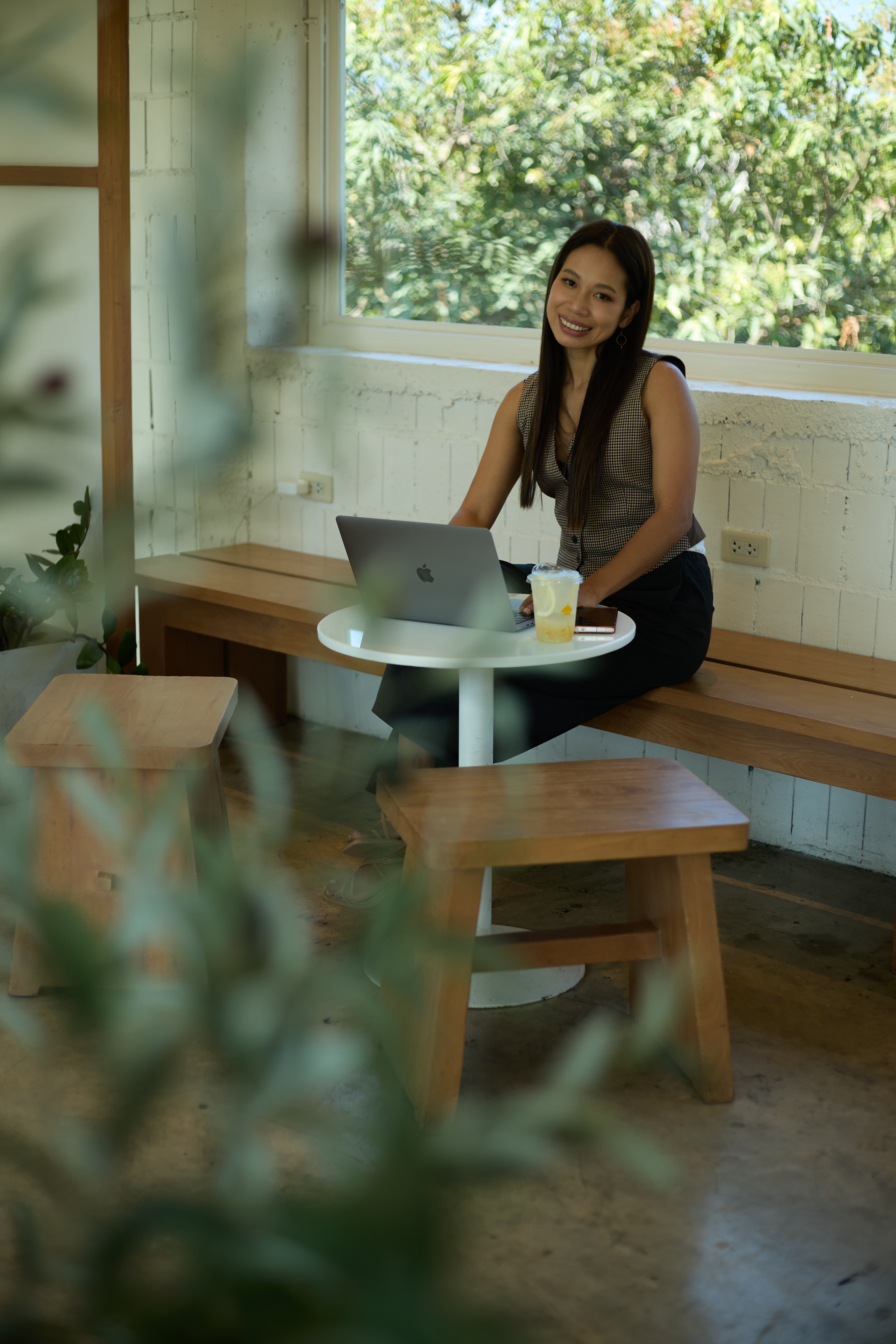 Fon Ward working at a cafe in Brisbane, natural light