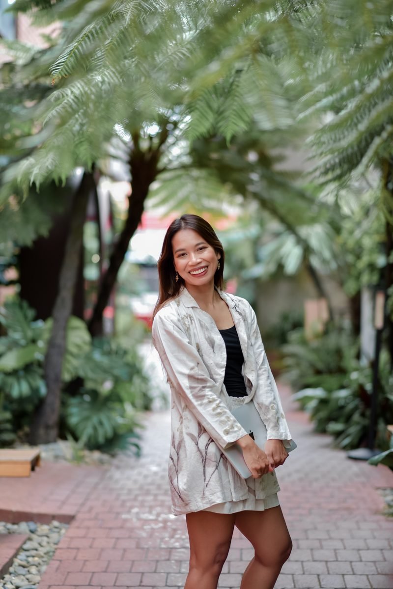Fon Ward standing in a garden laneway, SEO consultant for Australian manufacturers